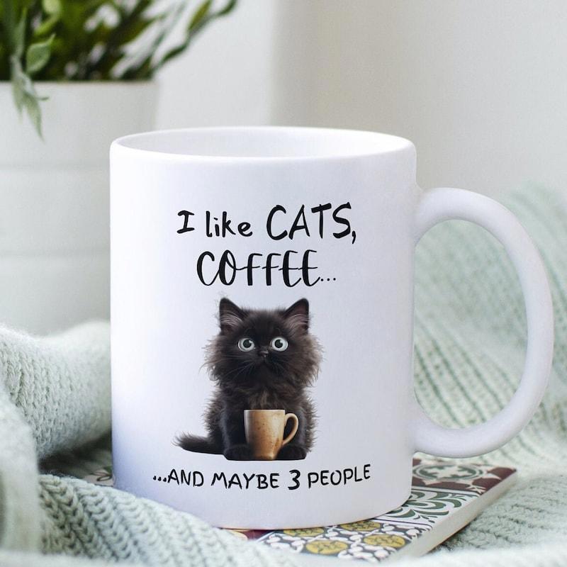 Tailorly White Ceramic 11 oz Mug - I Like Cats Coffee And Maybe 3 People Fluffy Black Feline Holding Small Tan Cup With Large Expressive Eyes Cat