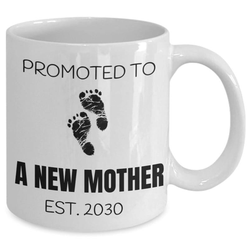 Tailorly White Ceramic 11 oz Mug - Promoted To A New Mother Est 2030 Tiny Infant Footprints Centered On A Clean Minimalist