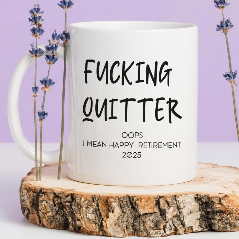 Tailorly White Ceramic 11 oz Mug - Fucking Quitter Oops I Mean Happy Retirement 2025 Minimalist Ceramic Design Resting On Natural Wood With Lavender Blossoms Mug