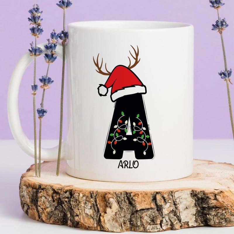 Tailorly White Ceramic 11 oz Mug - Arlo Festive Initial Character Adorned With Reindeer Antlers And Santa Hat Letter