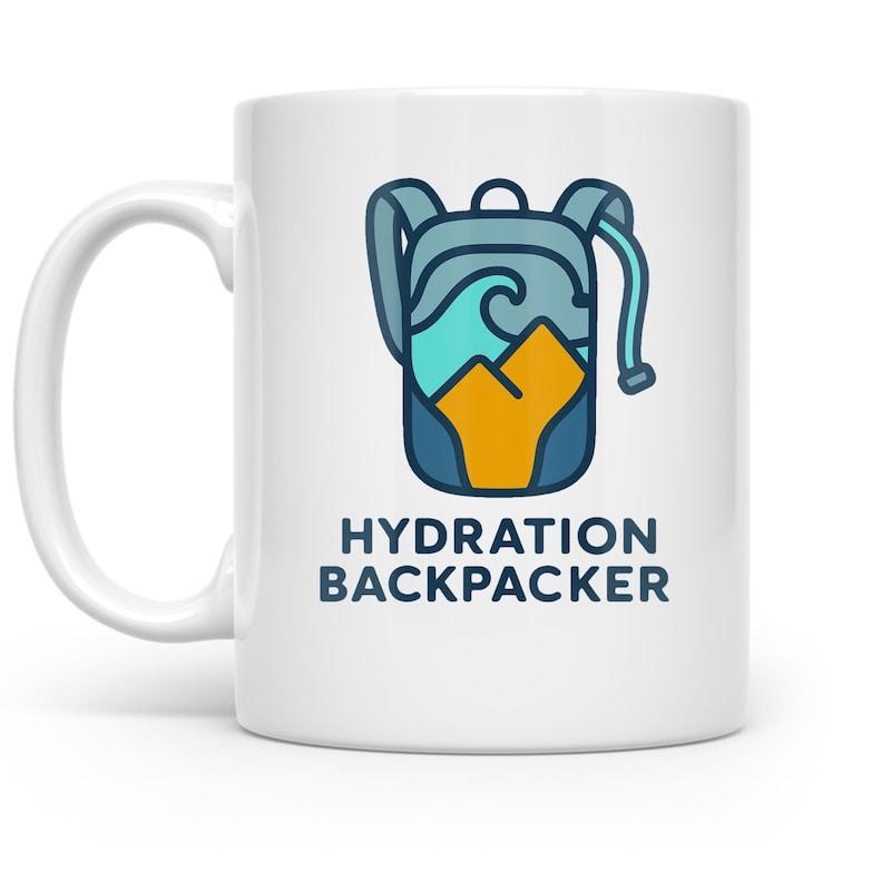 Tailorly White Ceramic 11 oz Mug - Hydration Backpacker Stylized Blue Outdoor Gear With Ocean Waves And Golden Mountains Backpack
