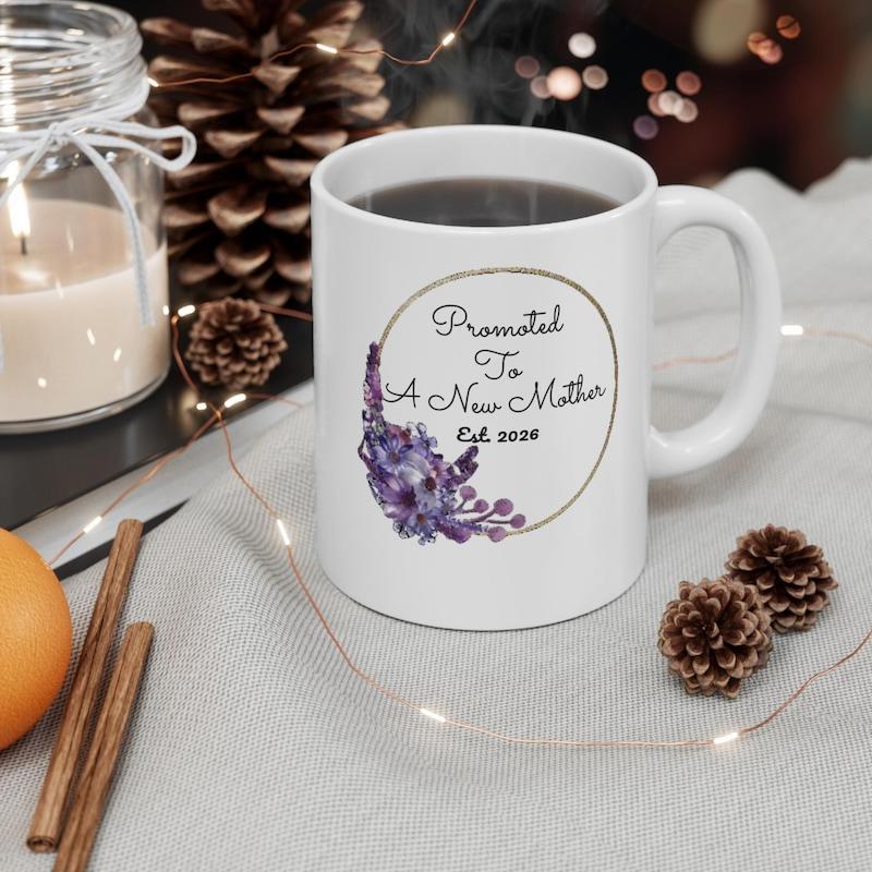 Tailorly White Ceramic 11 oz Mug - Promoted To A New Mother Elegant Circular Frame Decorated With Beautiful Purple Floral Accents And Leaves Mug
