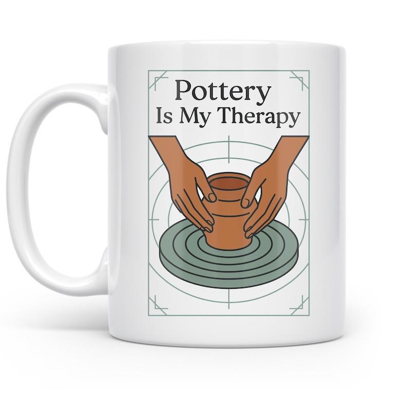 Tailorly White Ceramic 11 oz Mug - Pottery Is My Therapy Hands Shaping A Clay Pot Over A Spinning Circular Pottery Wheel