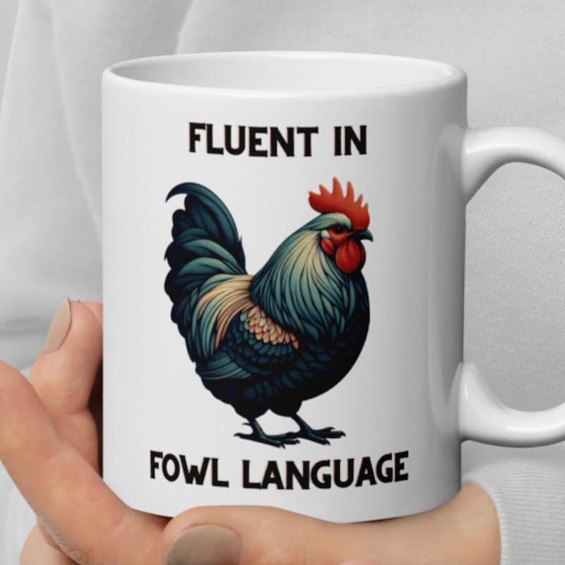 Tailorly White Ceramic 11 oz Mug - Fluent In Fowl Language Vibrant Colorful Feathers Standing On A Plain White Surface Rooster