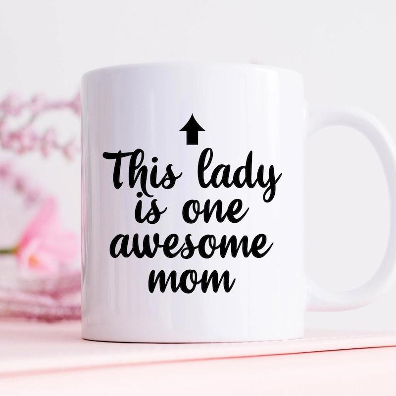 Tailorly White Ceramic 11 oz Mug - This Lady Is One Awesome Mom Simple Black Text Design With Decorative Upward Arrow Graphic Minimalist Mug