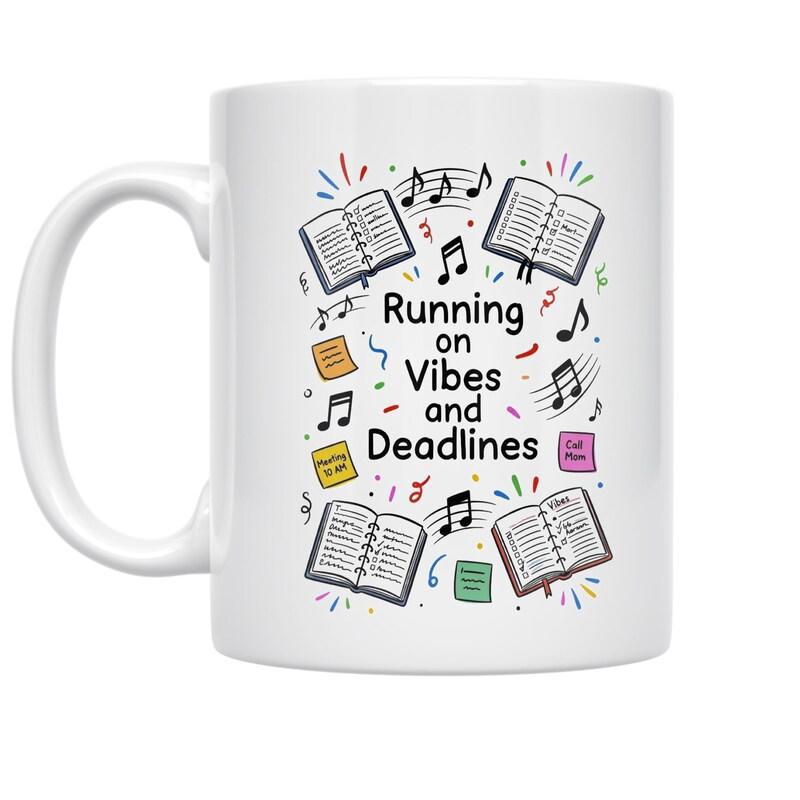 Tailorly White Ceramic 11 oz Mug - Running On Vibes And Deadlines Scattered Open Books With Dancing Musical Notes And Colorful Sticky Notes Design