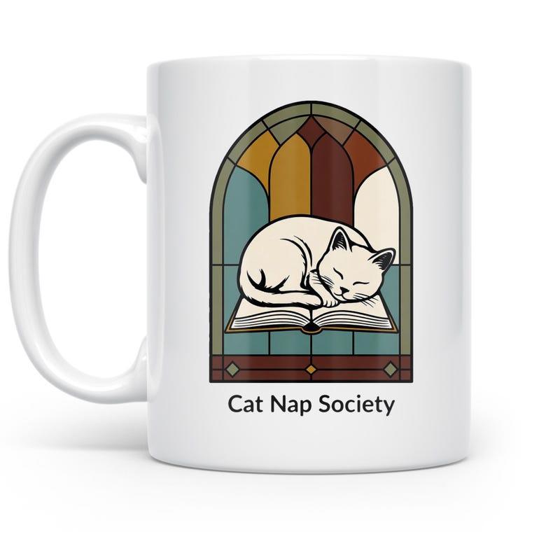 Tailorly White Ceramic 11 oz Mug - Cat Nap Society Peaceful Feline Resting On A Book Before Stained Glass Window Cat