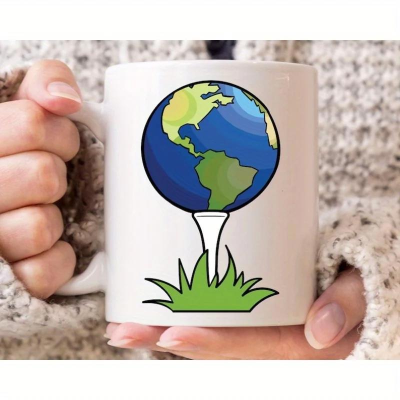 Tailorly White Ceramic 11 oz Mug - Colorful Planet Earth Resting On A White Tee Above Green Grass Globe