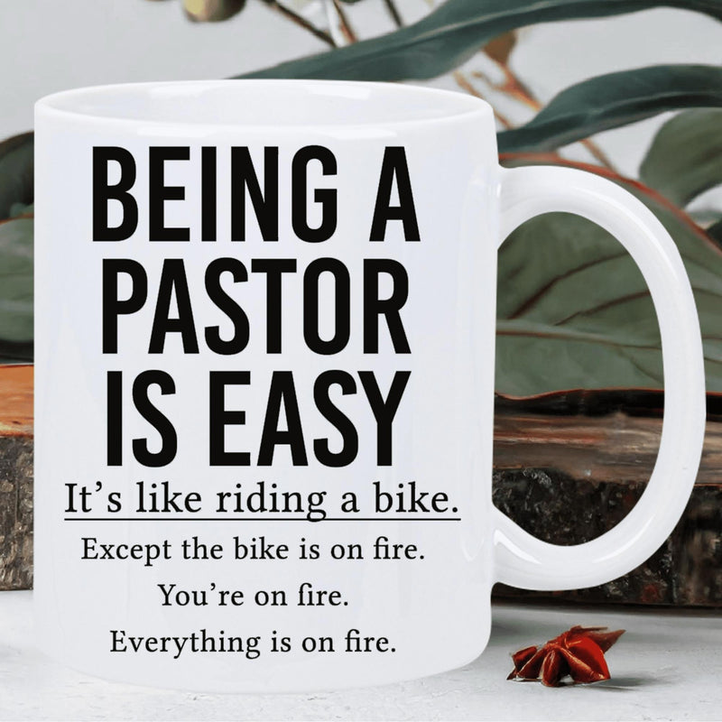 Tailorly White Ceramic 11 oz Mug - Being A Pastor Is Easy It S Like Riding A Bike Except The Bike Is On Fire You Re On Fire Everything Is On Fire Bold Black