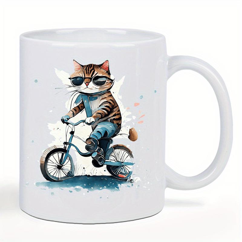 Tailorly White Ceramic 11 oz Mug - Cool Tabby Wearing Sunglasses Riding Small Bicycle On Splashed Background Cat