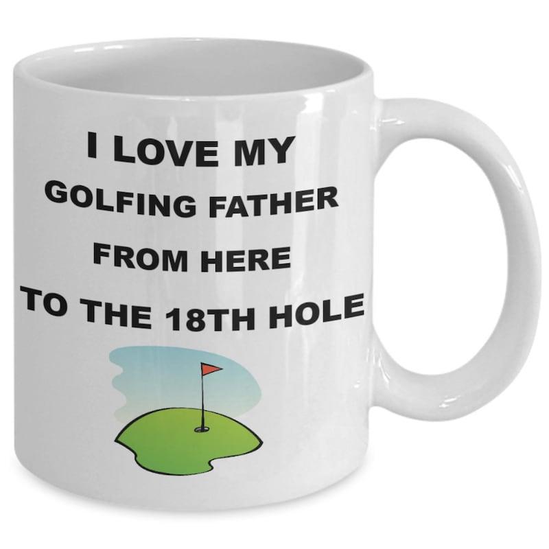 Tailorly White Ceramic 11 oz Mug - I Love My Golfing Father From Here To The 18th Hole Vibrant Green Putting Green Under Clear Sky With Red Flagstick Green