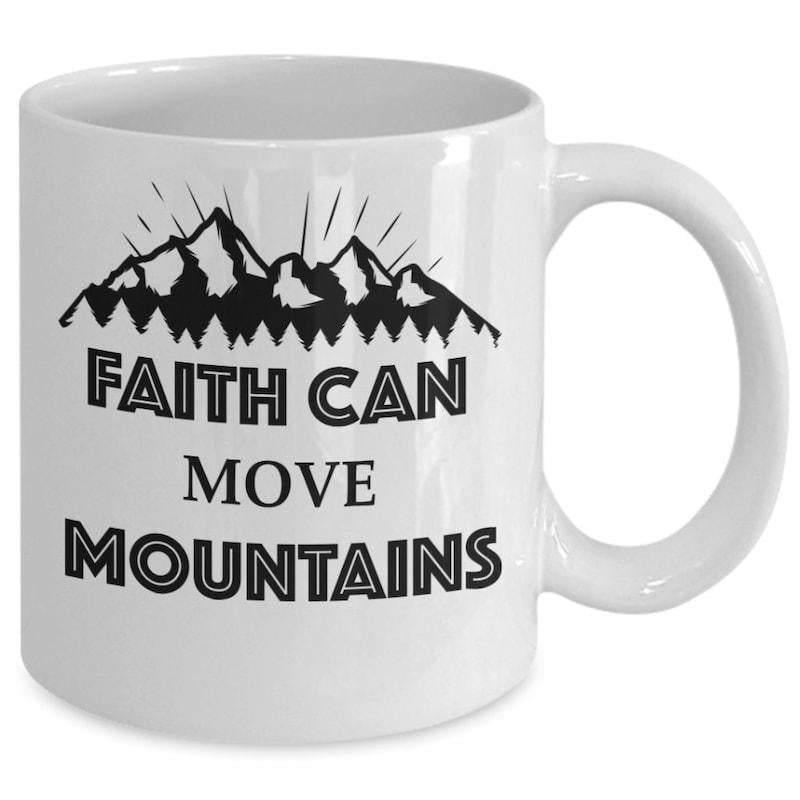 Tailorly White Ceramic 11 oz Mug - Faith Can Move Mountains Jagged Peaks Stretching Upwards Under Shining Radiant Sunbeam Rays Silhouette Mountain