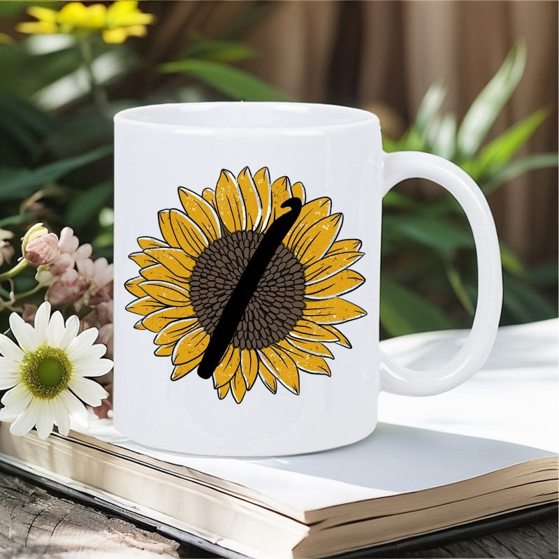 Tailorly White Ceramic 11 oz Mug - Bright Yellow Petals With A Silhouette Of A Black Crochet Hook Sunflower