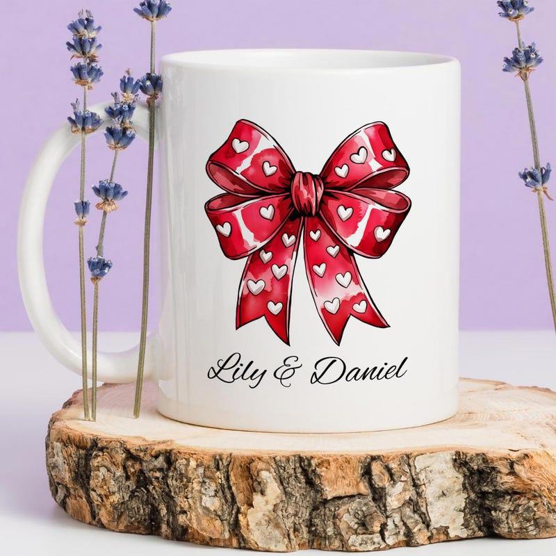Tailorly White Ceramic 11 oz Mug - Lily Daniel Elegant Red Ribbon Featuring Heart Patterns Floating On A White Background Bow
