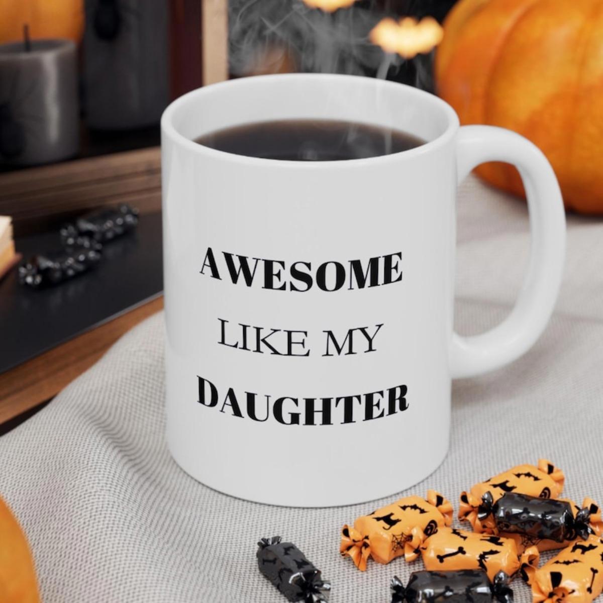 Tailorly White Ceramic 11 oz Mug - Awesome Like My Daughter Minimalist White Ceramic Vessel Sitting On A Textured Grey Fabric Mug
