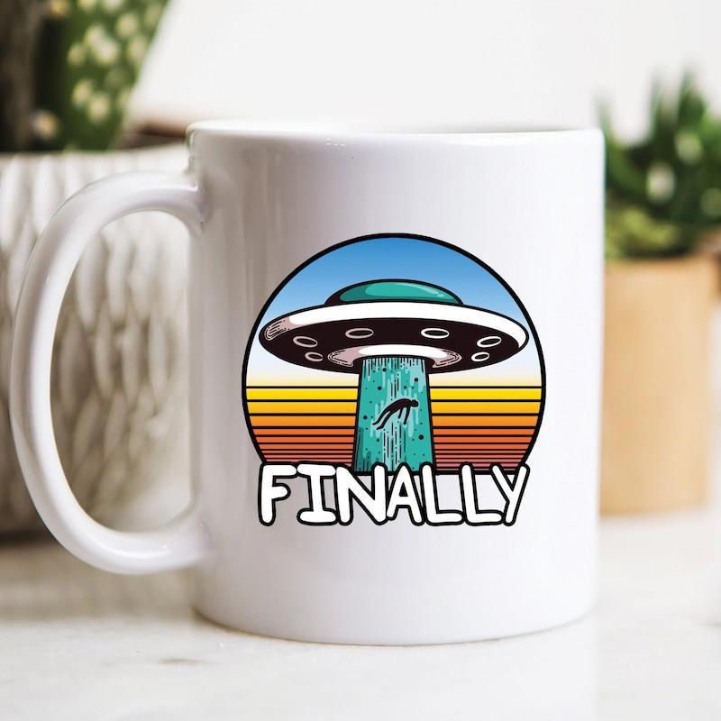 Tailorly White Ceramic 11 oz Mug - Finally Retro Circular Sunset Background With Flying Saucer Abducting Small Cow UFO