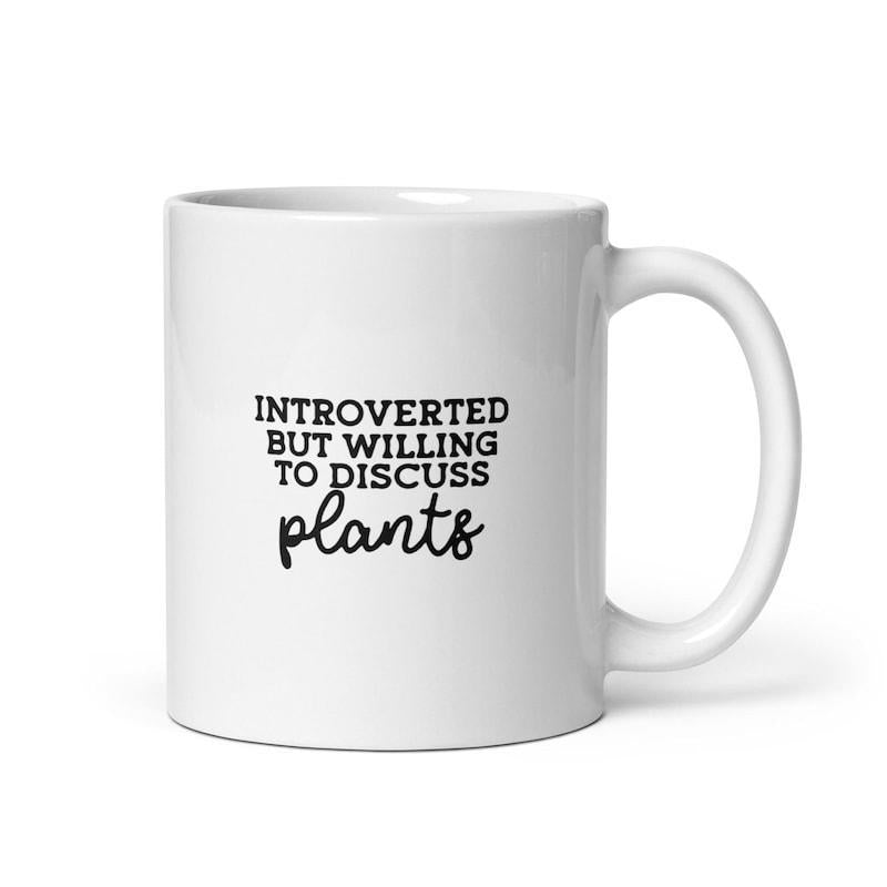 Tailorly White Ceramic 11 oz Mug - Introverted But Willing To Discuss Plants Simple Black Typography Styled On A Pristine White Background Ceramic Mug