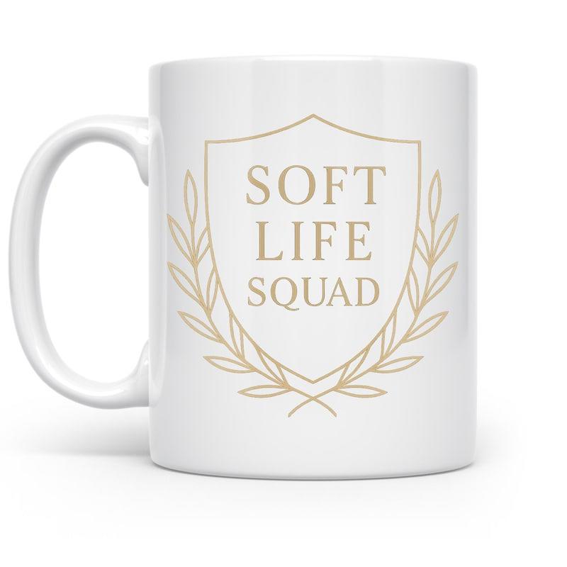 Tailorly White Ceramic 11 oz Mug - Soft Life Squad Elegant Golden Laurel Wreath Bordering A Minimalist Shield