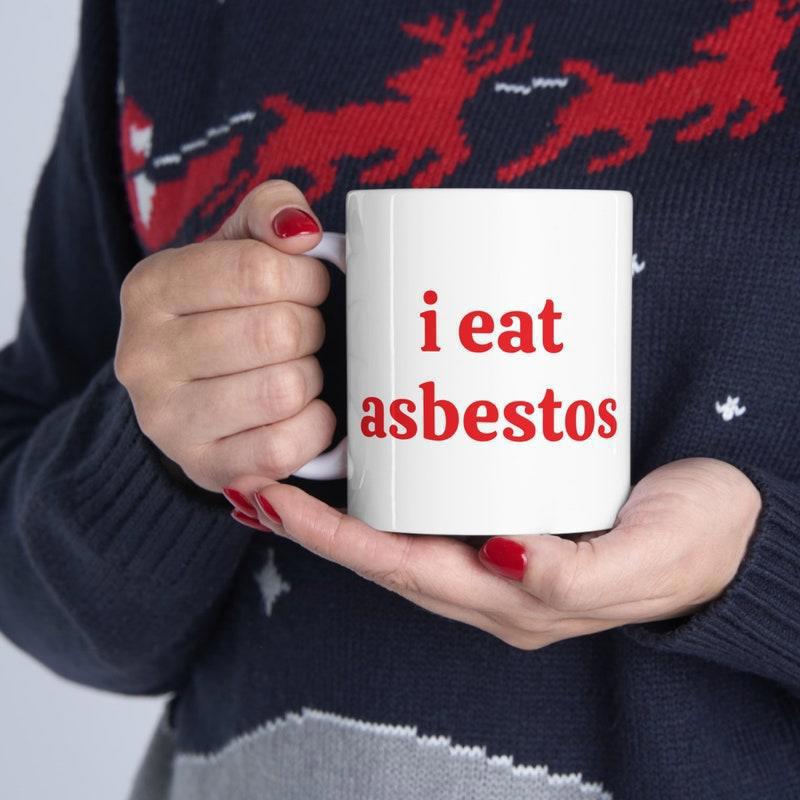 Tailorly White Ceramic 11 oz Mug - I Eat Asbestos Classic White Ceramic Held By Hands In Reindeer Sweater Mug