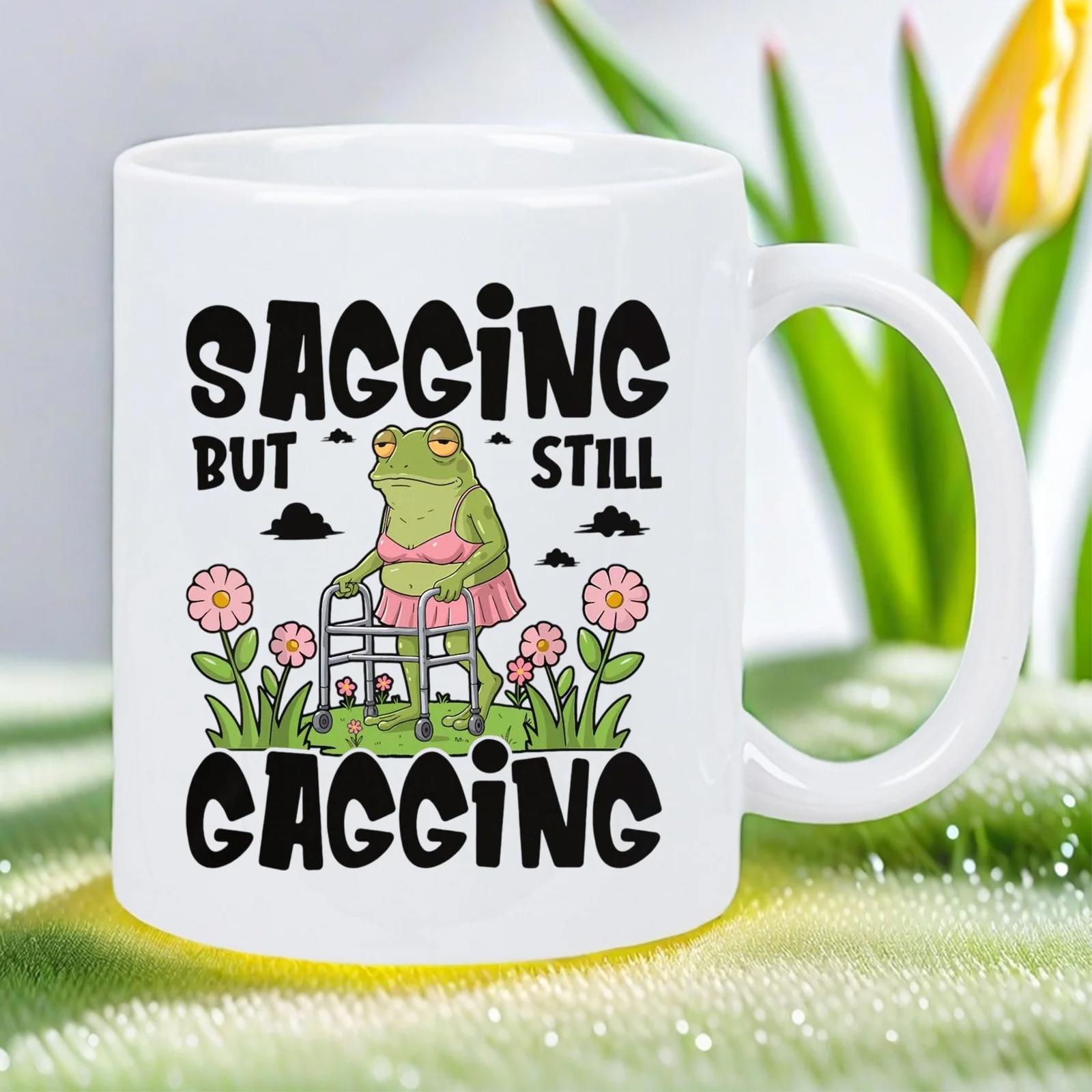Tailorly White Ceramic 11 oz Mug - Sagging But Still Gagging Humorous Cartoon Green Creature Wearing Pink Tutu Using Silver Walker Frog