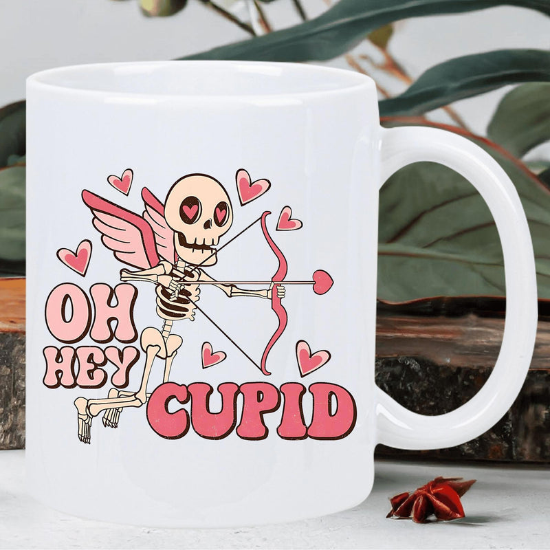 Tailorly White Ceramic 11 oz Mug - Oh Hey Cupid Retro Styled Winged Skeleton Drawing Bow Among Cute Floating Pink Hearts Skeleton