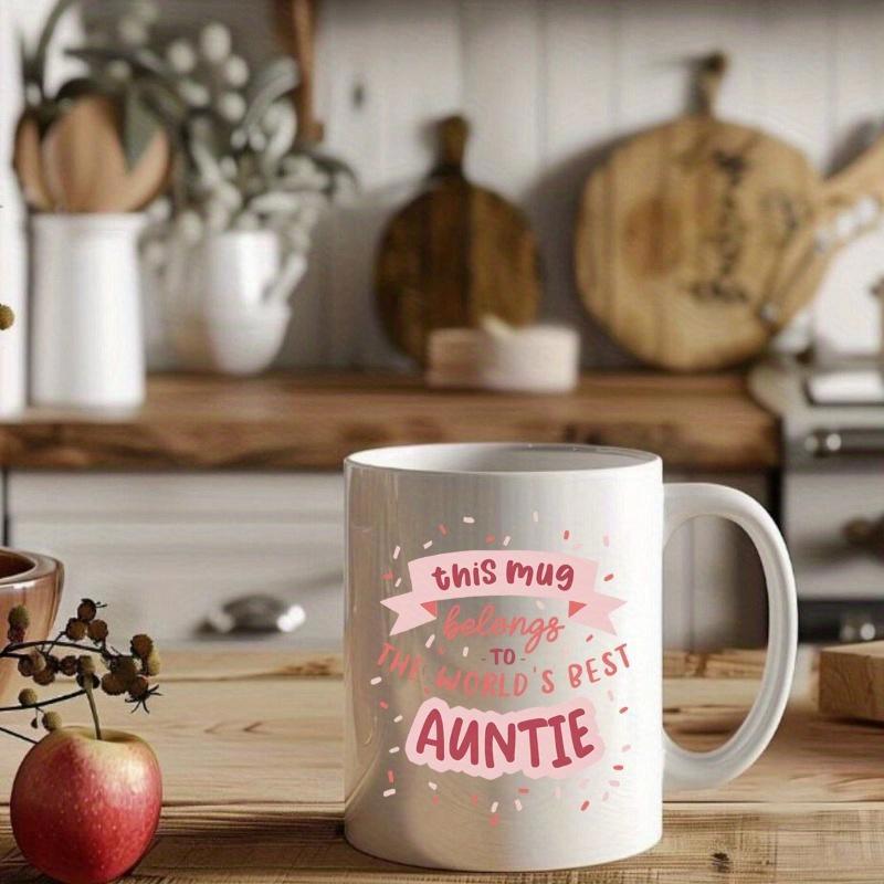 Tailorly White Ceramic 11 oz Mug - This Mug Belongs To Worlds Best Auntie Minimalist White Ceramic Cylinder Featuring Pink Ribbons And Tiny Scattered Hearts Mug