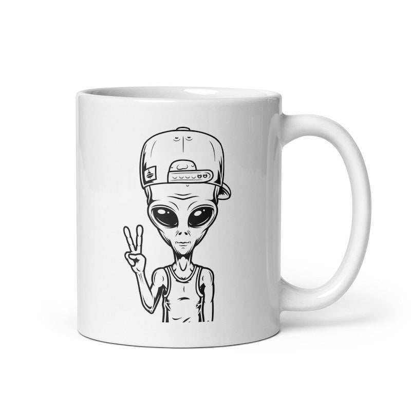 Tailorly White Ceramic 11 oz Mug - Cool Hip Hop Style Wearing Baseball Cap Making Peace Sign Gesture Cartoon Alien