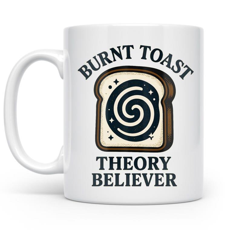 Tailorly White Ceramic 11 oz Mug - Burnt Toast Theory Believer Stylized Piece Of Bread With Cosmic Spiral Swirl And Tiny Twinkling Stars Toast