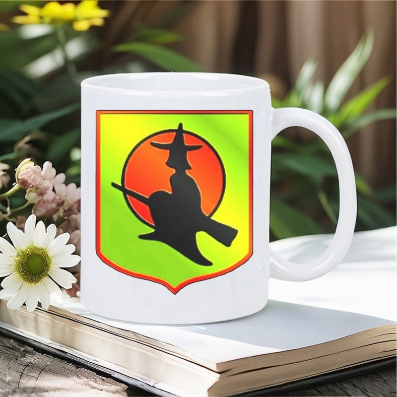 Tailorly White Ceramic 11 oz Mug - Silhouette Flying On Broomstick Across Large Orange Sun Inside Gradient Shield Witch