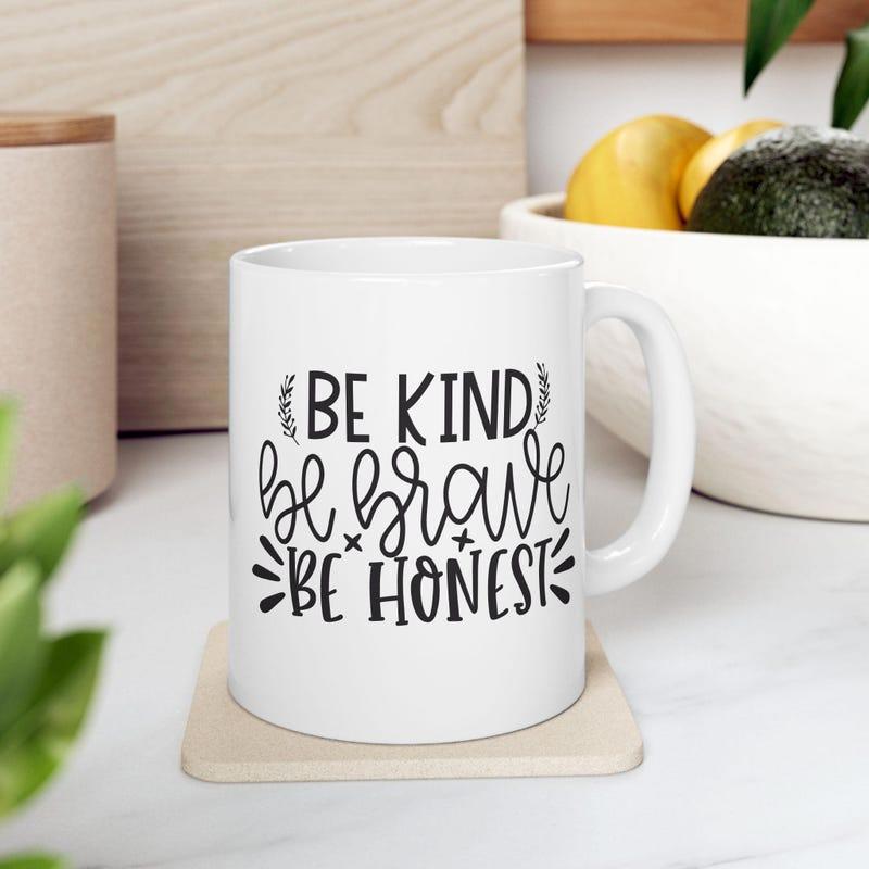 Tailorly White Ceramic 11 oz Mug - Be Kind Be Brave Be Honest Motivational Typography With Decorative Leaves And Radiant Sunburst Minimalist Black Ink Mug