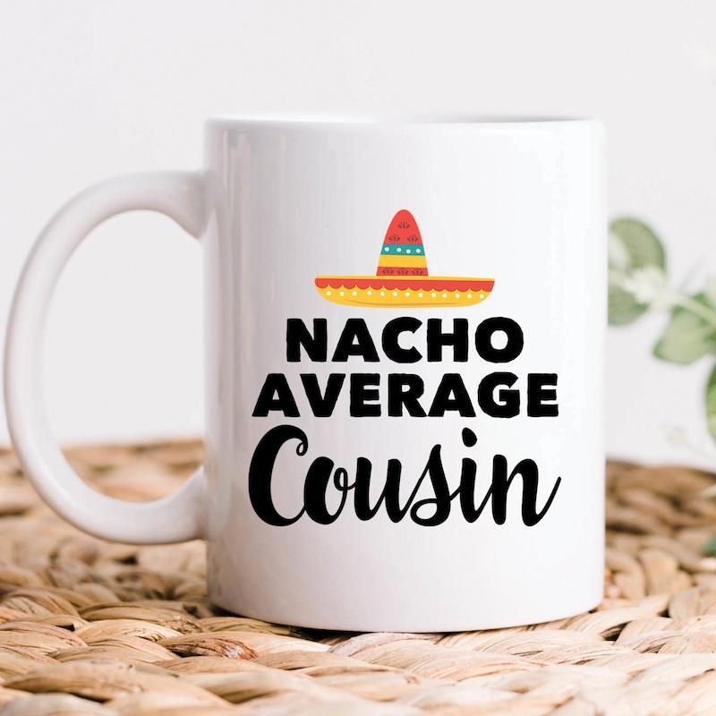 Tailorly White Ceramic 11 oz Mug - Nacho Average Cousin Colorful Mexican Hat With Vibrant Stripes Resting Above Bold Stylized Playful Typography Sombrero
