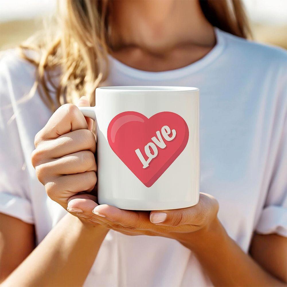 Tailorly White Ceramic 11 oz Mug - Love Soft Radiant Pink Shape With Decorative Cursive Lettering Floating Over Minimalist White Surface Heart