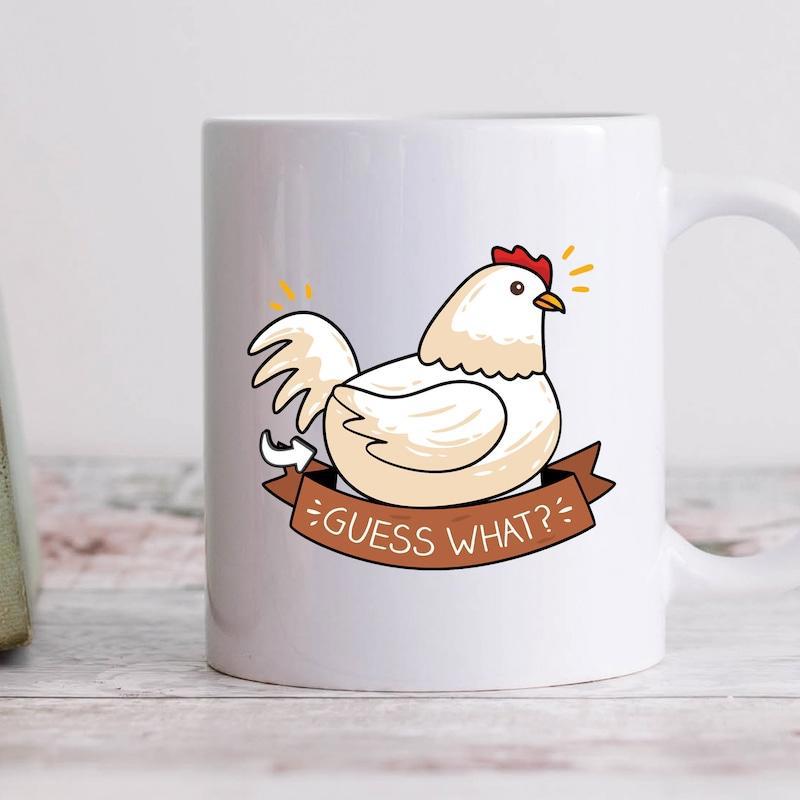 Tailorly White Ceramic 11 oz Mug - Guess What Charming Cartoon White Hen Sitting Gracefully Above A Brown Ribbon Banner Chicken