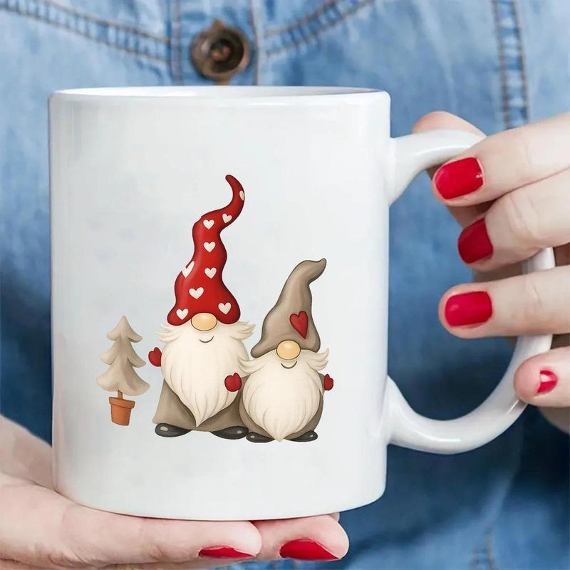 Tailorly White Ceramic 11 oz Mug - Two Festive Christmas Gnomes Wearing Heart Patterned Hats Beside Small Potted Gnomes