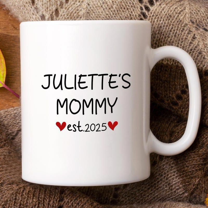 Tailorly White Ceramic 11 oz Mug - Juliettes Mommy Est 2025 Featuring Charming Handwritten Typography And Tiny Red Hearts Mug