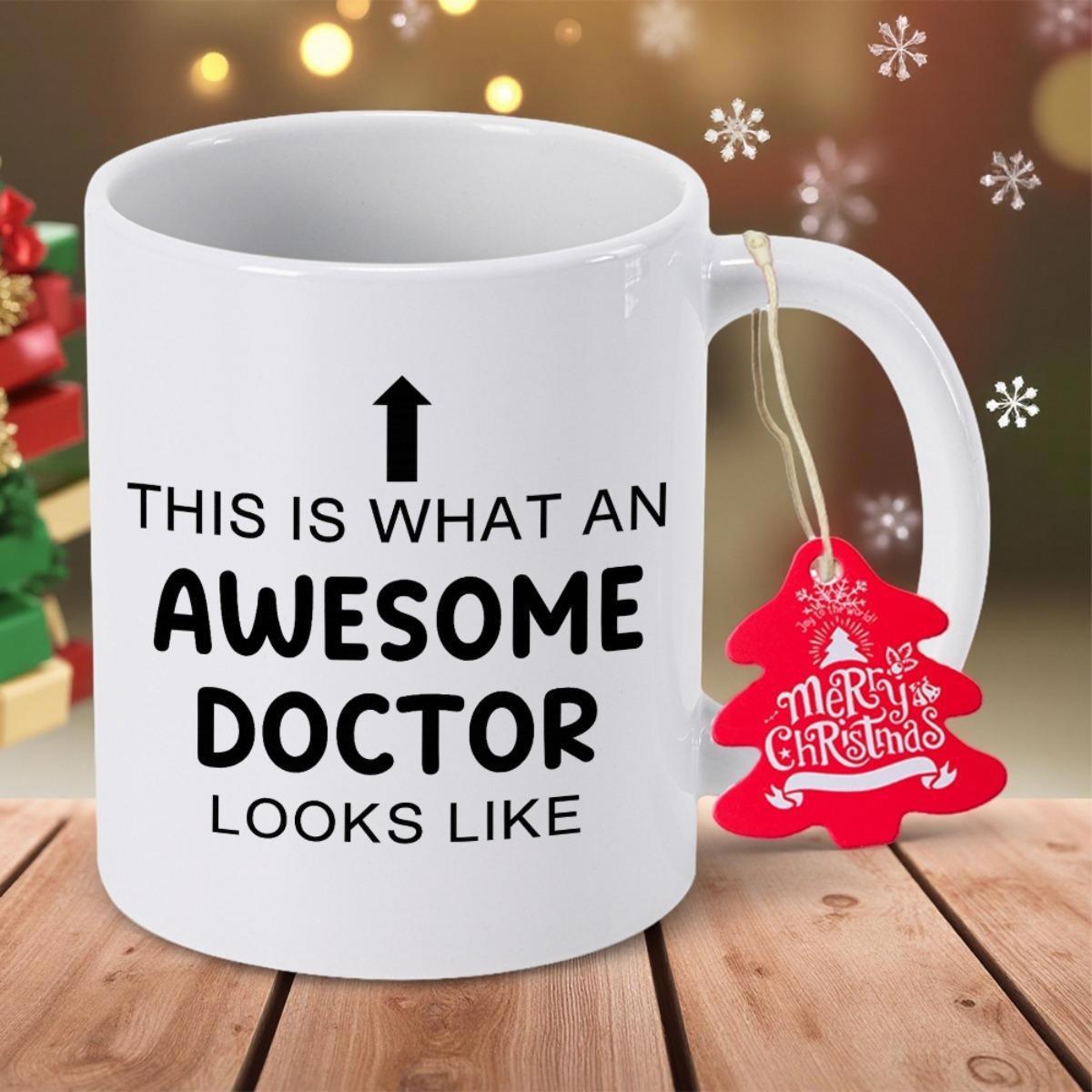 Tailorly White Ceramic 11 oz Mug - This Is What An Awesome Doctor Looks Like Resting On Wooden Table With Red Festive Tag Mug
