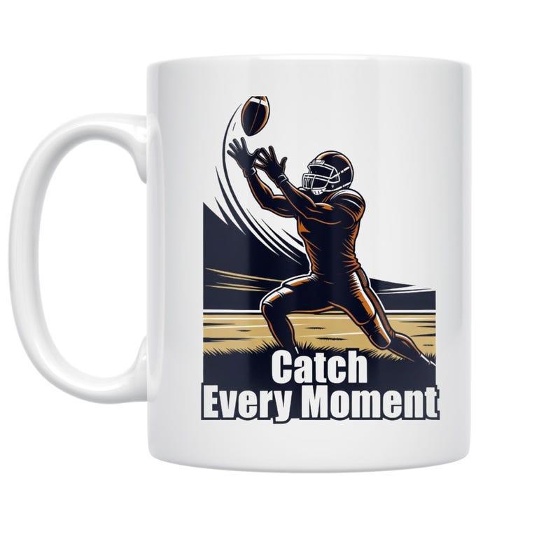 Tailorly White Ceramic 11 oz Mug - Catch Every Moment Strong Athletic Figure Catching A Flying Football On A Grassy Field Player