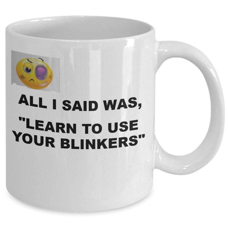 Tailorly White Ceramic 11 oz Mug - All I Said Was Learn To Use Your Blinkers Sarcastic Bruised Yellow Emoji Face Displayed On A Smooth Ceramic Mug