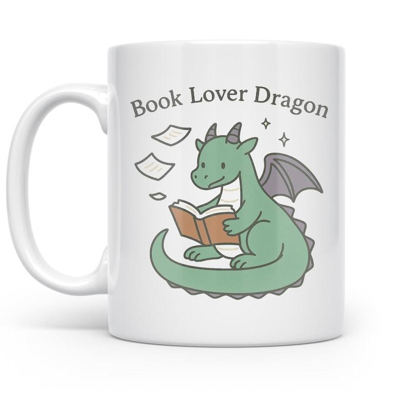 Tailorly White Ceramic 11 oz Mug - Book Lover Dragon Cute Green Creature Sitting Peacefully Reading An Open Book Among Floating Pages Dragon