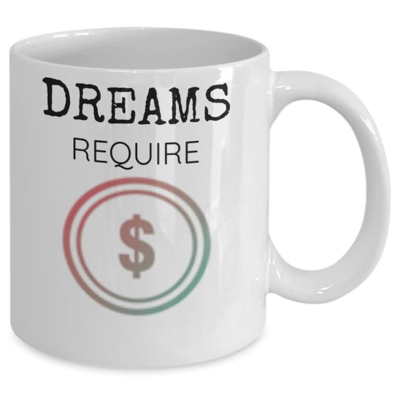 Tailorly White Ceramic 11 oz Mug - Dreams Require Vibrant Multi Colored Concentric Circles Surrounding A Gradient Monetary Sign