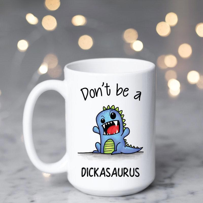 Tailorly White Ceramic 11 oz Mug - Don't Be A Dickasaurus Cheerful Blue Baby Dinosaur Sitting On Ground With Its Mouth Wide Open Dinosaur