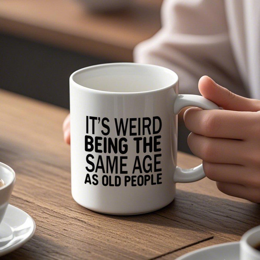 Tailorly White Ceramic 11 oz Mug - Its Weird Being The Same Age As Old People Bold Sans Serif Text Displayed In Modern Centered Minimalist Quote Sign