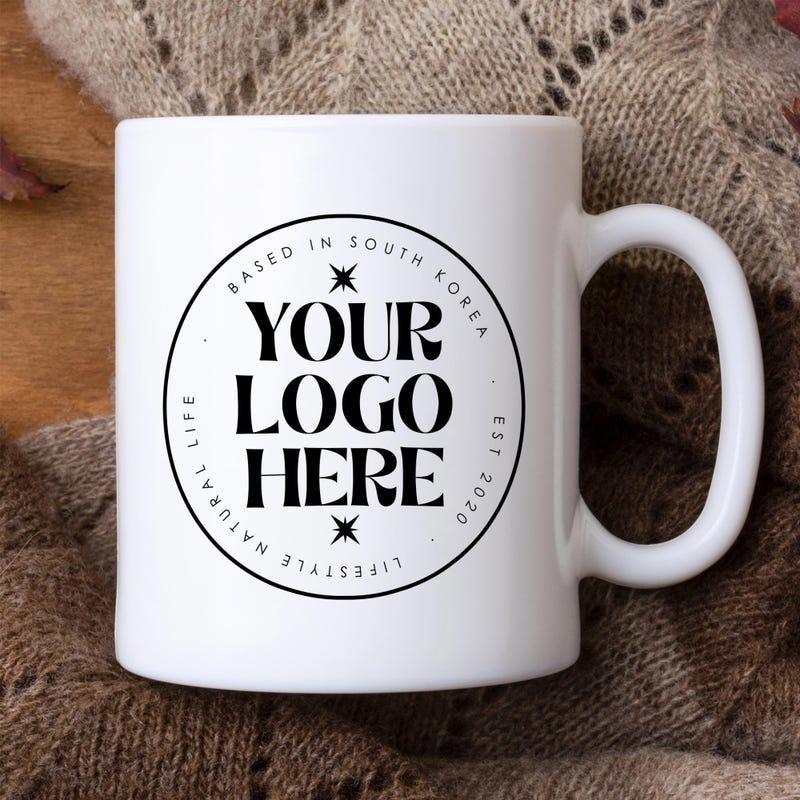 Tailorly White Ceramic 11 oz Mug - Your Logo Here Based In South Korea Est 2020 Lifestyle Natural Life Minimalist Black Circular Badge Centered Against A Smooth