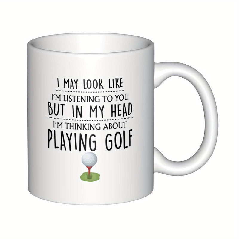 Tailorly White Ceramic 11 oz Mug - I May Look Like I Am Listening To You But In My Head I Am Thinking About Playing Golf Simple Textured White Ball Resting Upon A