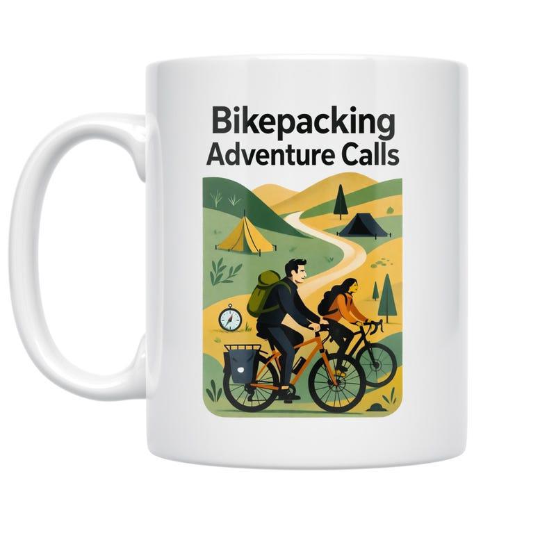 Tailorly White Ceramic 11 oz Mug - Bikepacking Adventure Calls Two People Cycling On A Winding Path Through Rolling Green Hills Mug