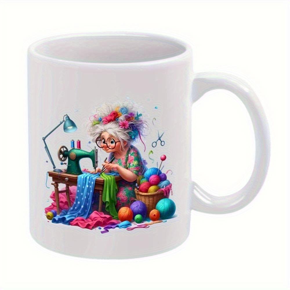 Tailorly White Ceramic 11 oz Mug - Whimsical Elderly Woman Working On Sewing Machine Surrounded By Colorful Yarn Seamstress
