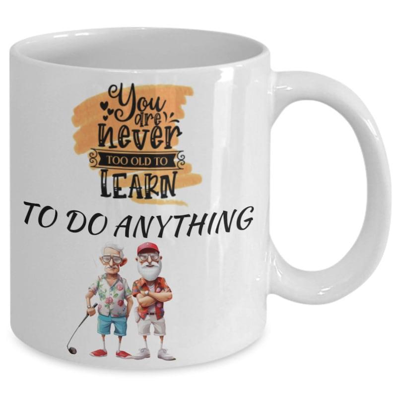 Tailorly White Ceramic 11 oz Mug - You Are Never Too Old To Learn To Do Anything Two Elder Men With Golf Club Standing Under Inspirational Quote Mug