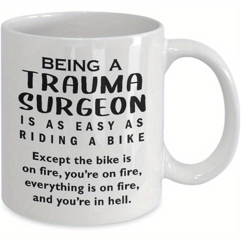 Tailorly White Ceramic 11 oz Mug - Being A Trauma Surgeon Is As Easy As Riding A Bike Except The Bike Is On Fire Youre On Fire Everything Is On Fire And Youre In