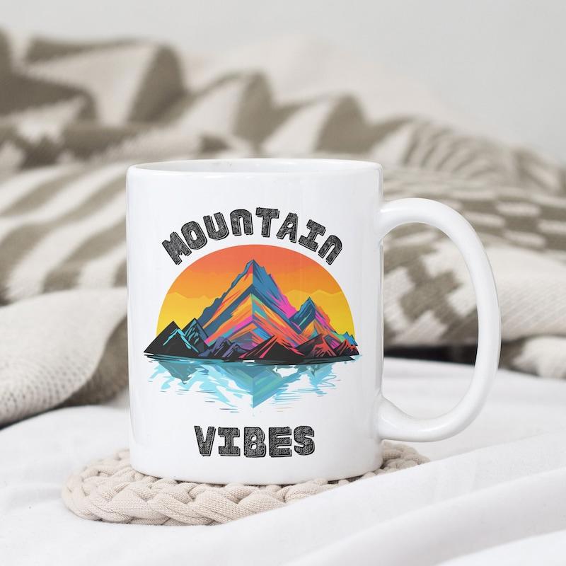 Tailorly White Ceramic 11 oz Mug - Mountain Vibes Colorful Abstract Peaks Reflecting Over Calm Water Under A Golden Sunset Mountain