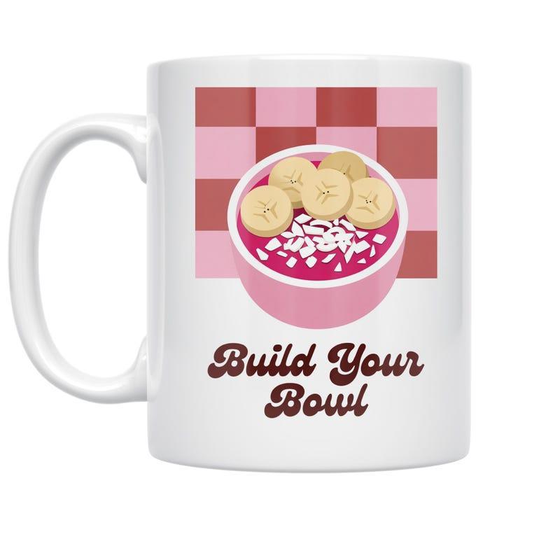 Tailorly White Ceramic 11 oz Mug - Build Your Bowl Vibrant Pink Smoothie Topped With Sliced Bananas Over Checkerboard Pattern Bowl